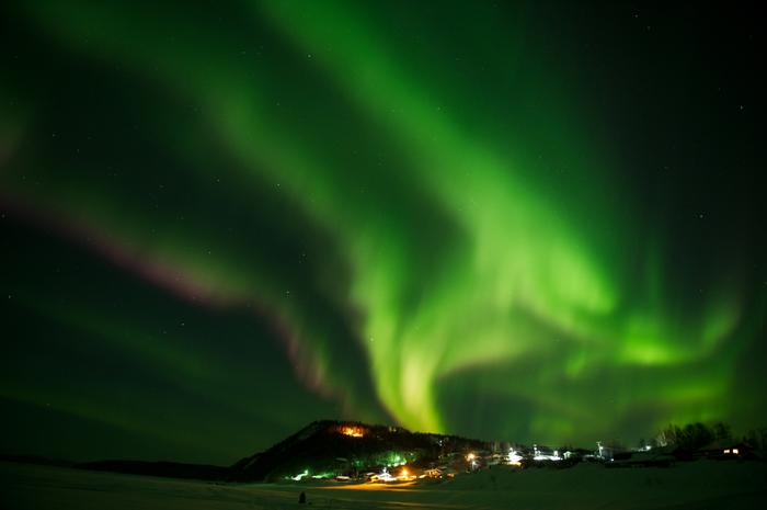 In this Friday, March 9, 2012 photo, an aurora borealis swirls in the sky over the Yukon River village of Ruby, Alaska, a checkpoint of the Iditarod Trail Race.